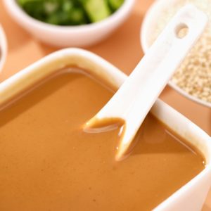 a bowl of soup with a spoon sticking out of it