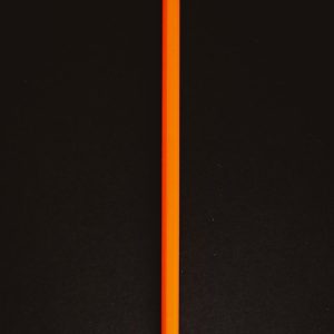 orange pencil on black textile
