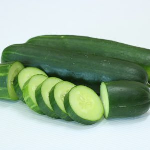 A group of cucumbers on a white surface